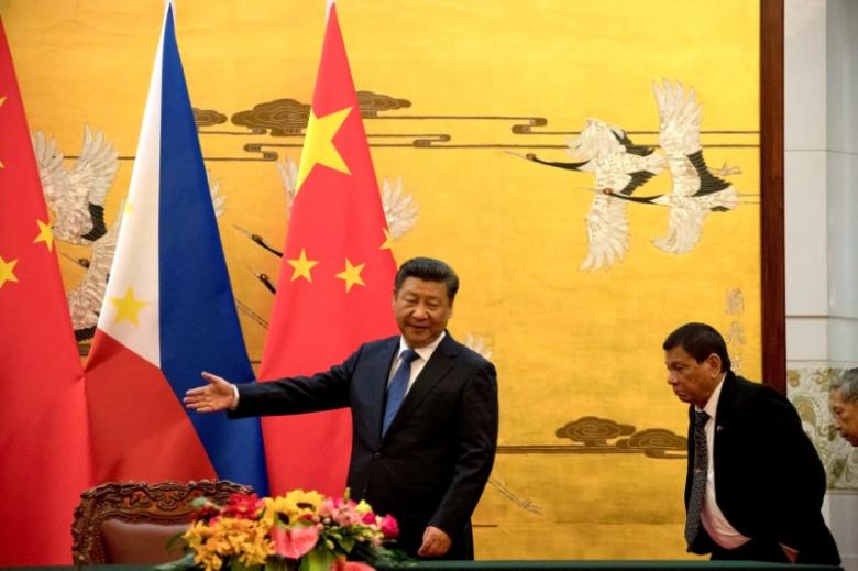 File photo of Philippine President Rodrigo Duterte shown the way by Chinese President Xi Jinping before a signing ceremony held in Beijing